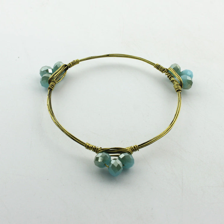 Pulsera de cordón metálico con dijes B1489