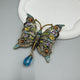 Broche de mariposa hueco con diamantes de imitación PA5138 