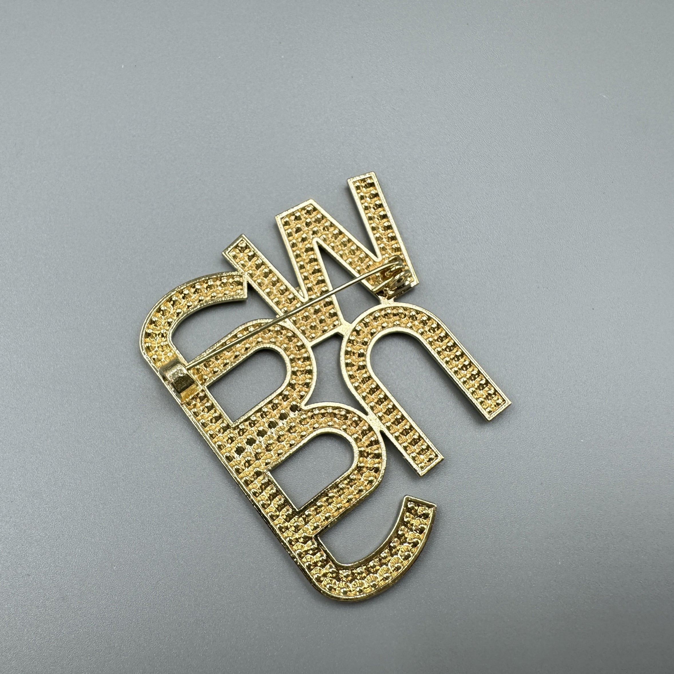 Wang store brooch